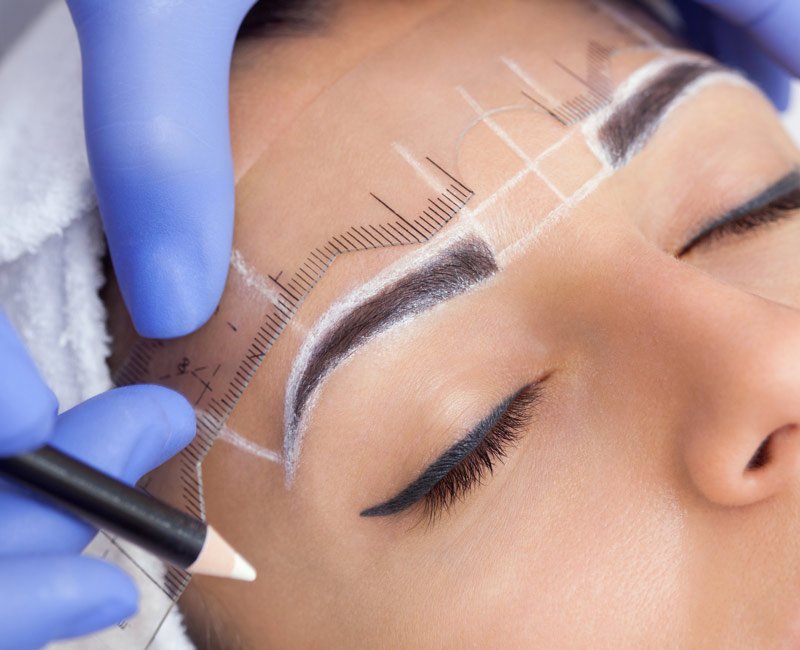 Eyebrow Microblading on a girl forhead
